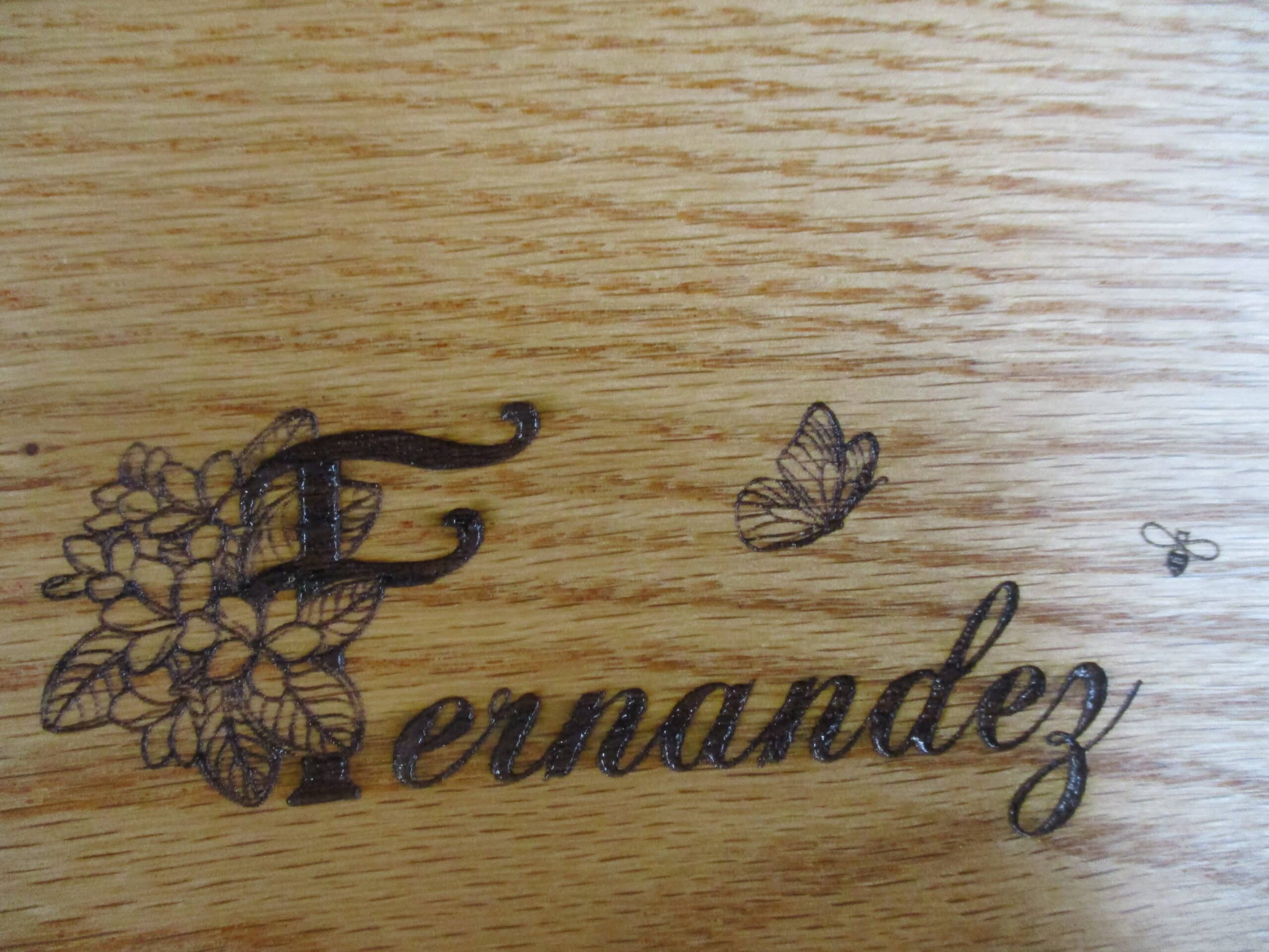 Custom artwork engraved on Oak and Padauk charcuterie board as a birthday gift.