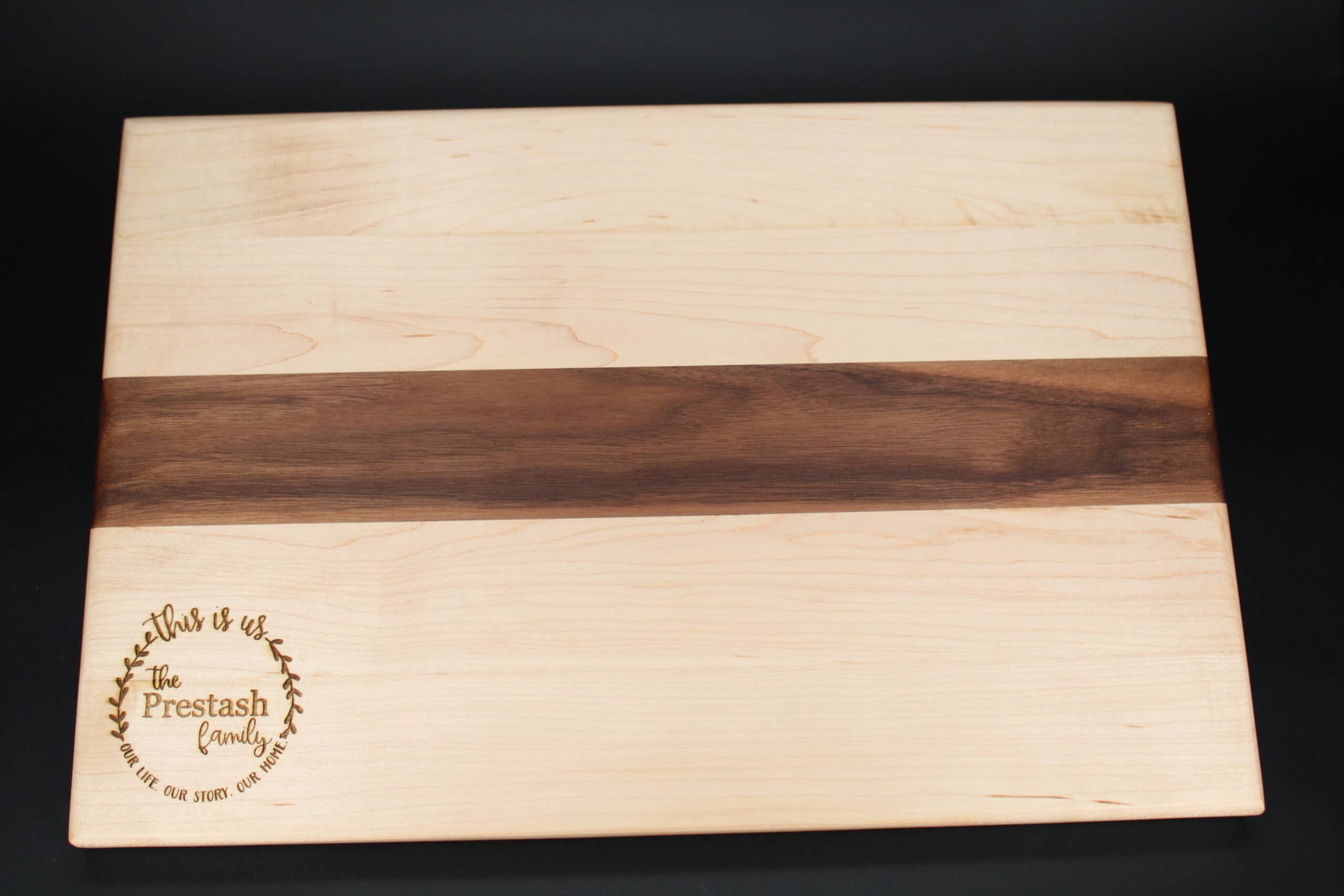 custom wreath engraved on Maple and Walnut cutting board/charcuterie board as a closing gift