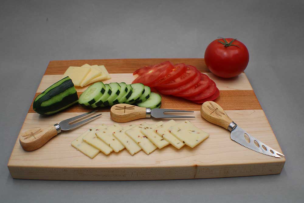 Cherry and maple charcuterie board with cutlery farm fresh vegetables cheese and crackers dragonfly wood arts