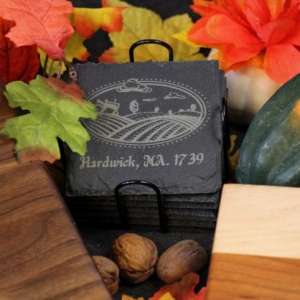 A set of eight customizable 4 inch square slate coasters with a wire rack The coasters are made of natural slate and can be engraved with any design you choose Perfect for protecting your furniture and adding a touch of personality to your home décor dragonfly wood arts