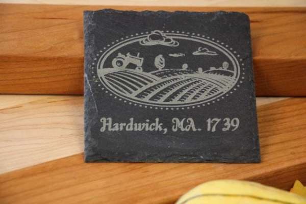 Customizable 4inch square slate coaster with a picture of a tractor plowing a field and the text hardwick ma 1739 dragonfly wood arts