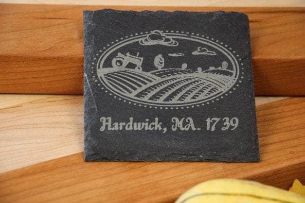 Customizable 4inch square slate coaster with a picture of a tractor plowing a field and the text "Hardwick, MA. 1739."